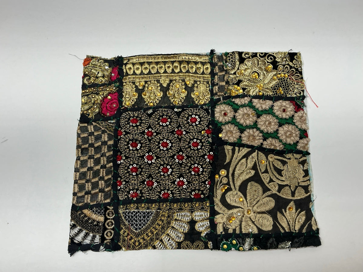 Black and gold embroidered patchwork textile panel