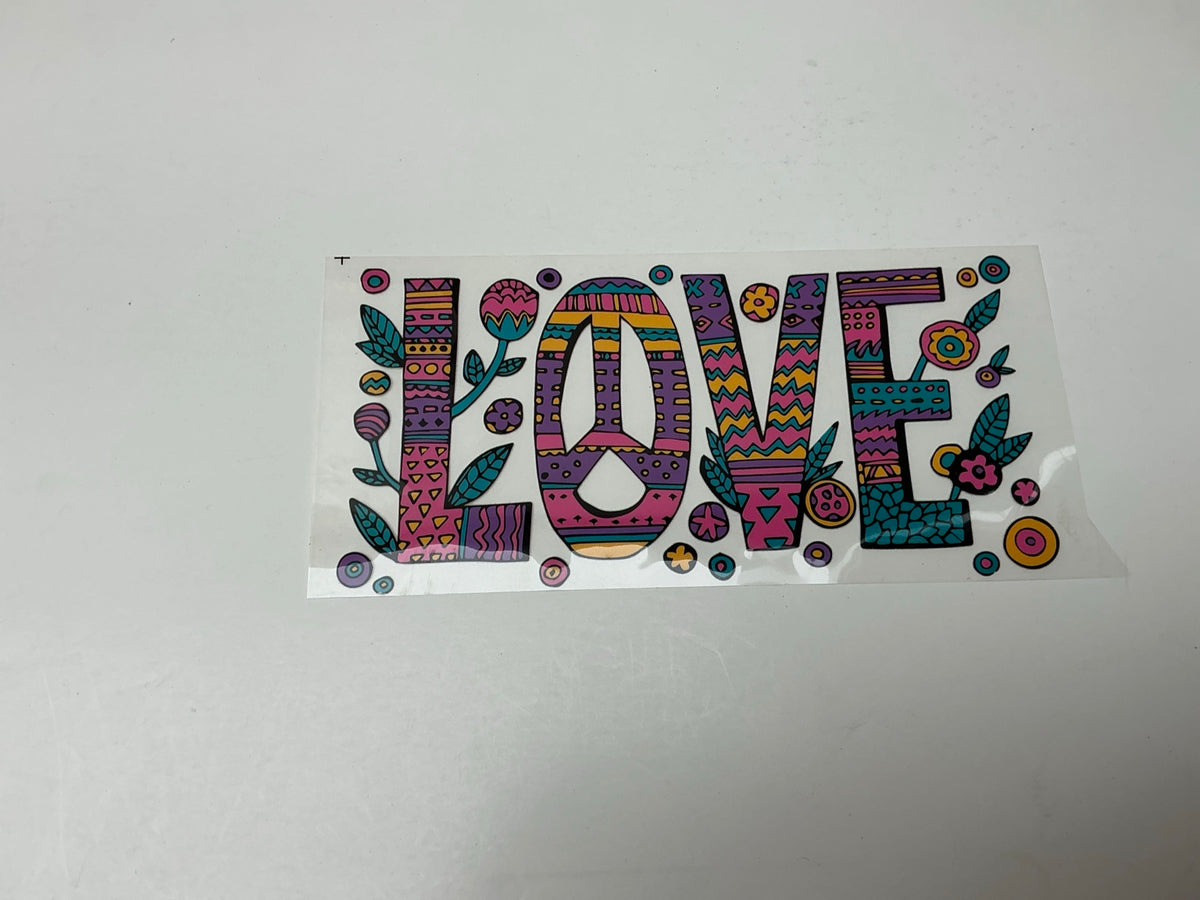 Colorful patterned LOVE statement embellishment with peace sign and flowers