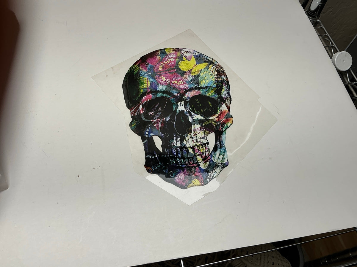 Dark skull statement embellishment covered with colorful butterflies