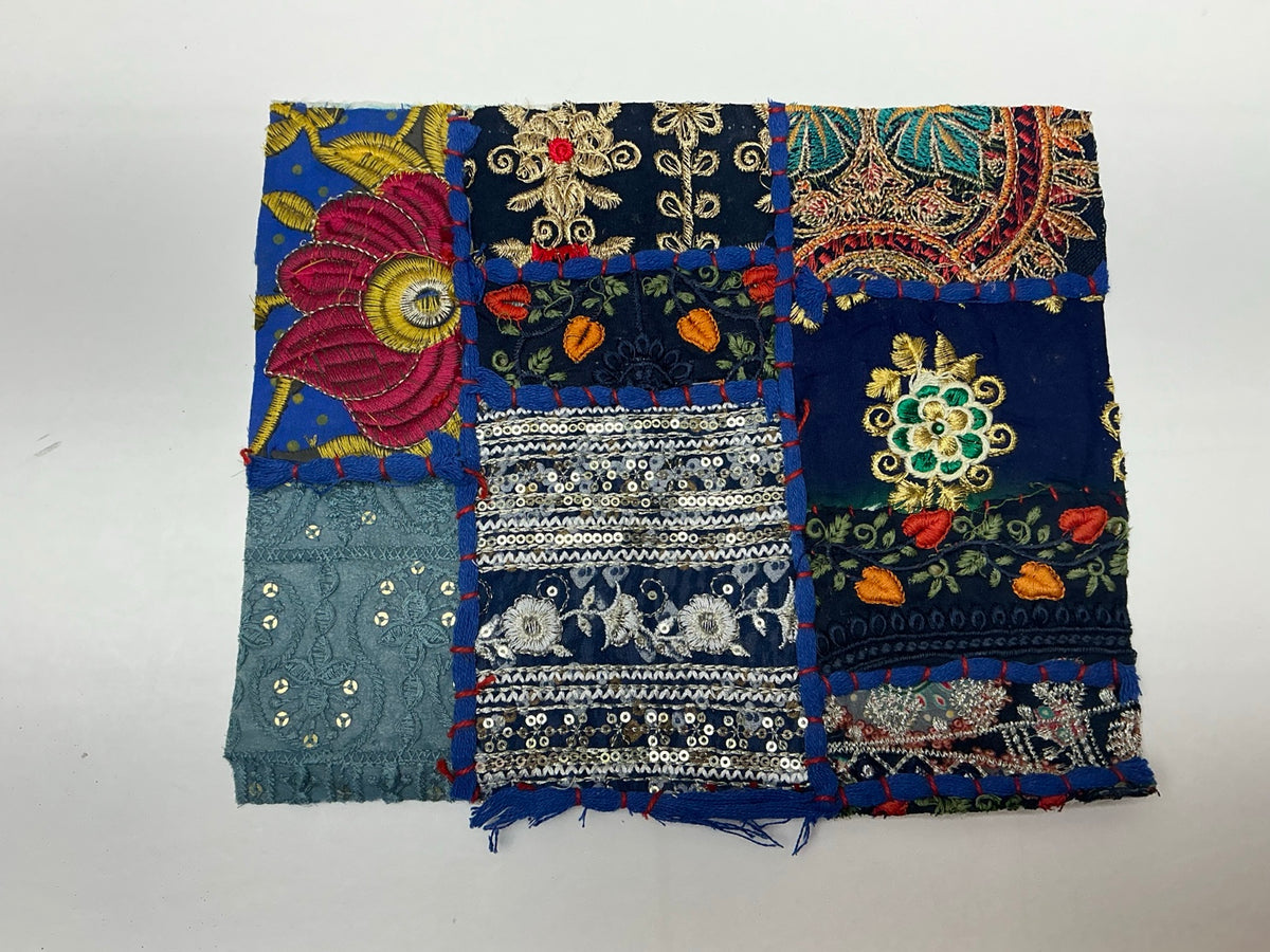Midnight blue embroidered patchwork textile panel with florals and sequins