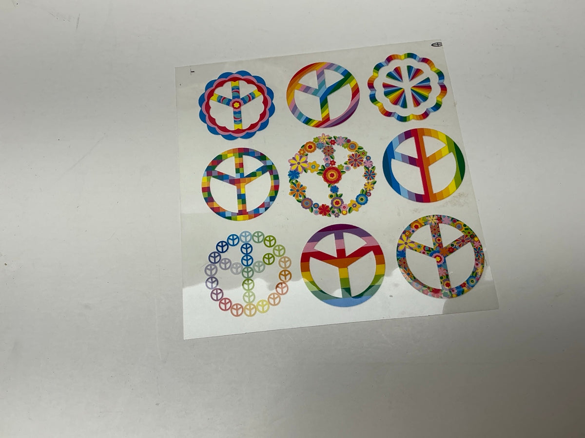 Assorted colorful rainbow floral and geometric peace sign embellishments