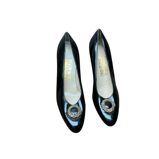 Salvatore Ferragamo black patent leather pumps with gold medallion accent, size 8.5